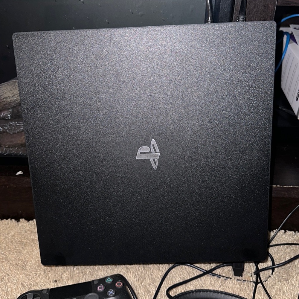 Play station 4 with head set, 2 controllers, and 12 games. Some are new.
